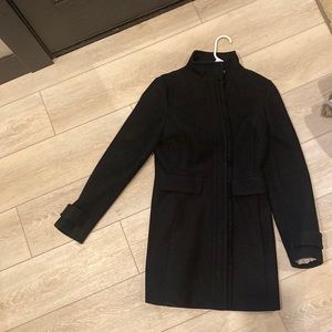 Banana republic black coat with Detail down the zipper. Button at top